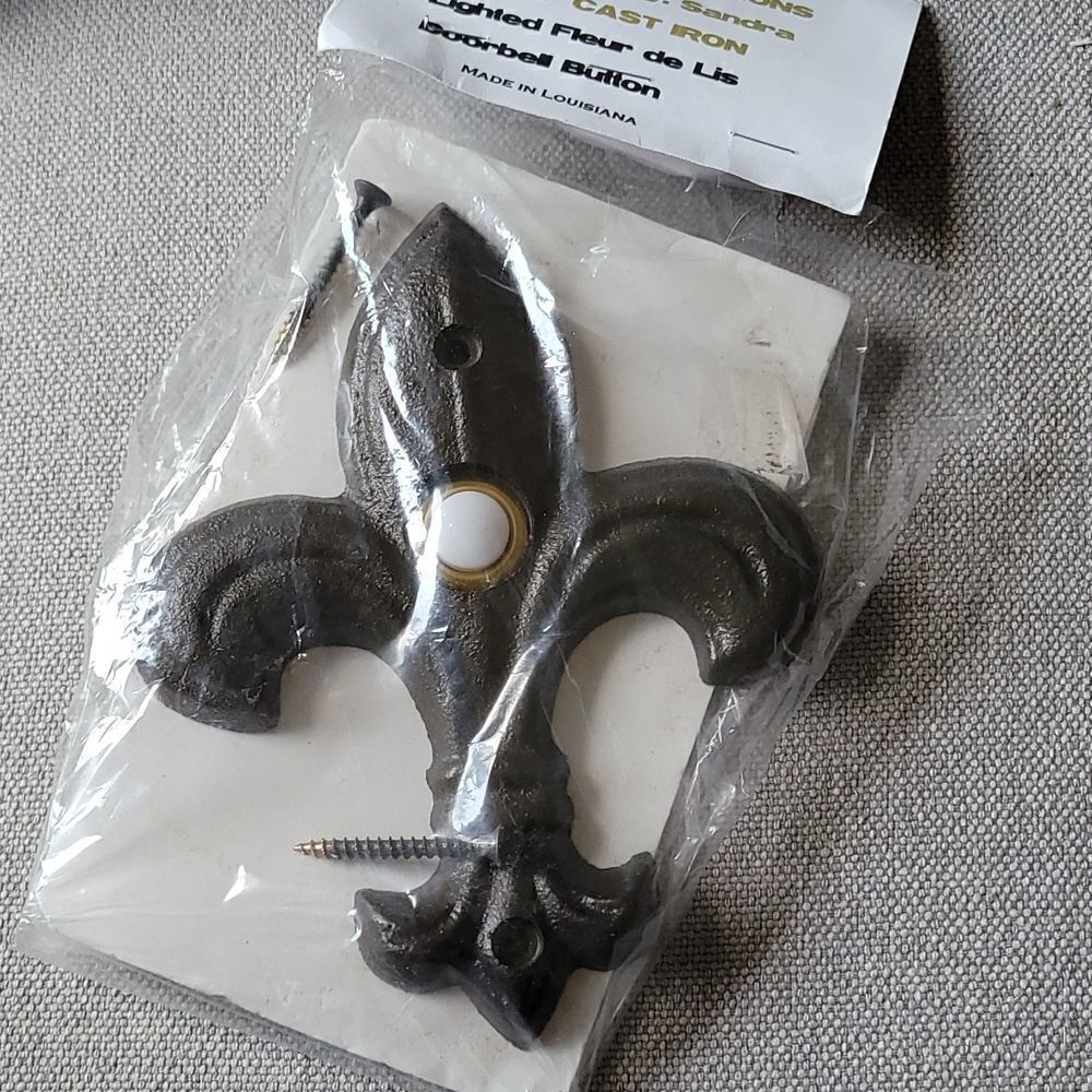 Cast iron lighted fleur-de-lis doorbell